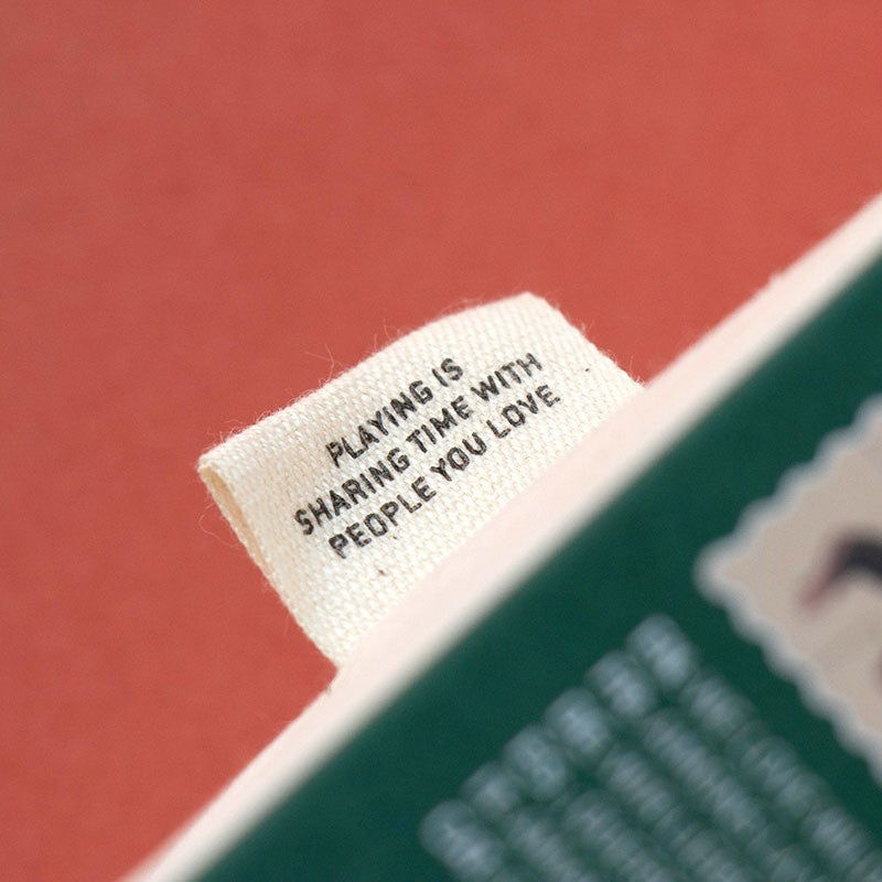 Text tag on a product with motivational quote against a red background