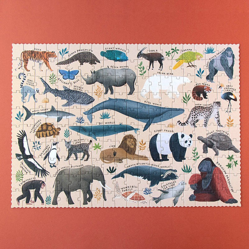 200-piece-life-puzzle with illustrations of various animals on a red background