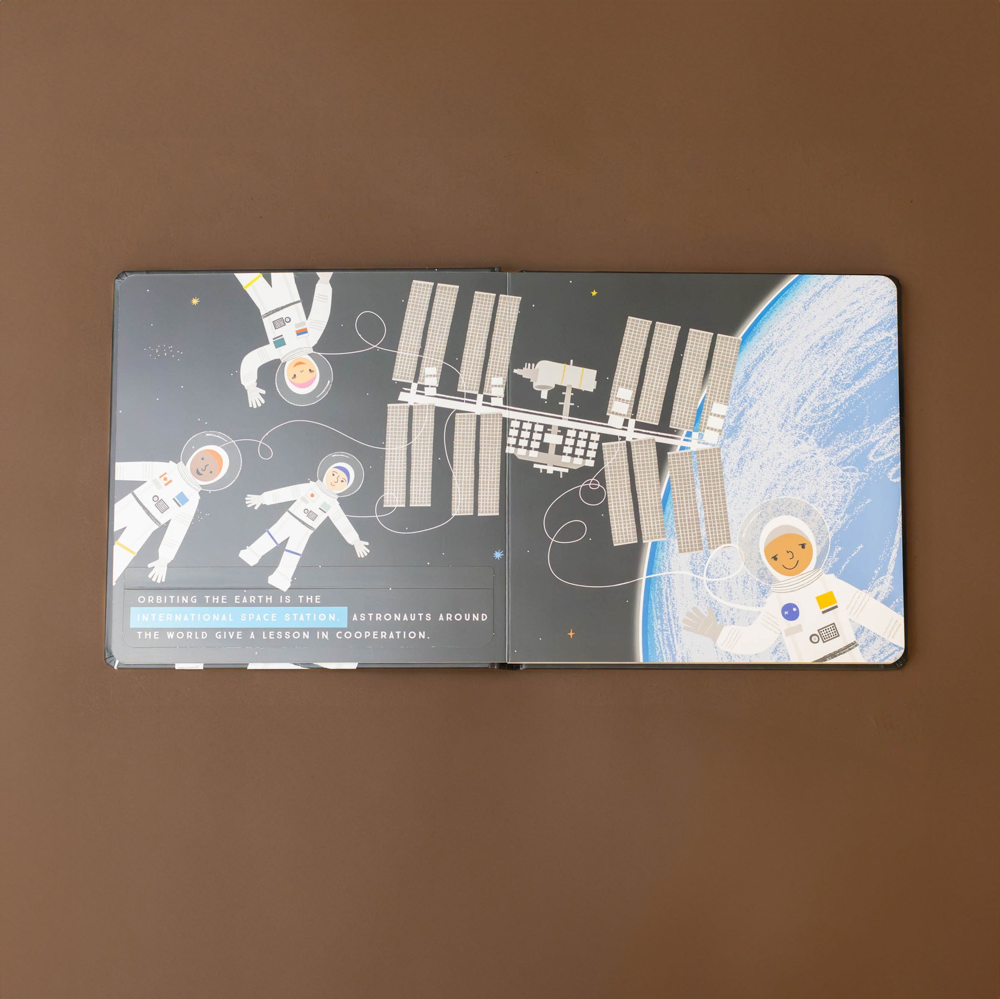 astronauts-and-satellite-above-earth