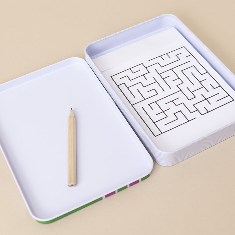 A white rectangular tray set shown open on a beige background, with one tray displaying a black maze drawing and the other tray holding a wooden pencil. The tray edges have small multicolor stripes.