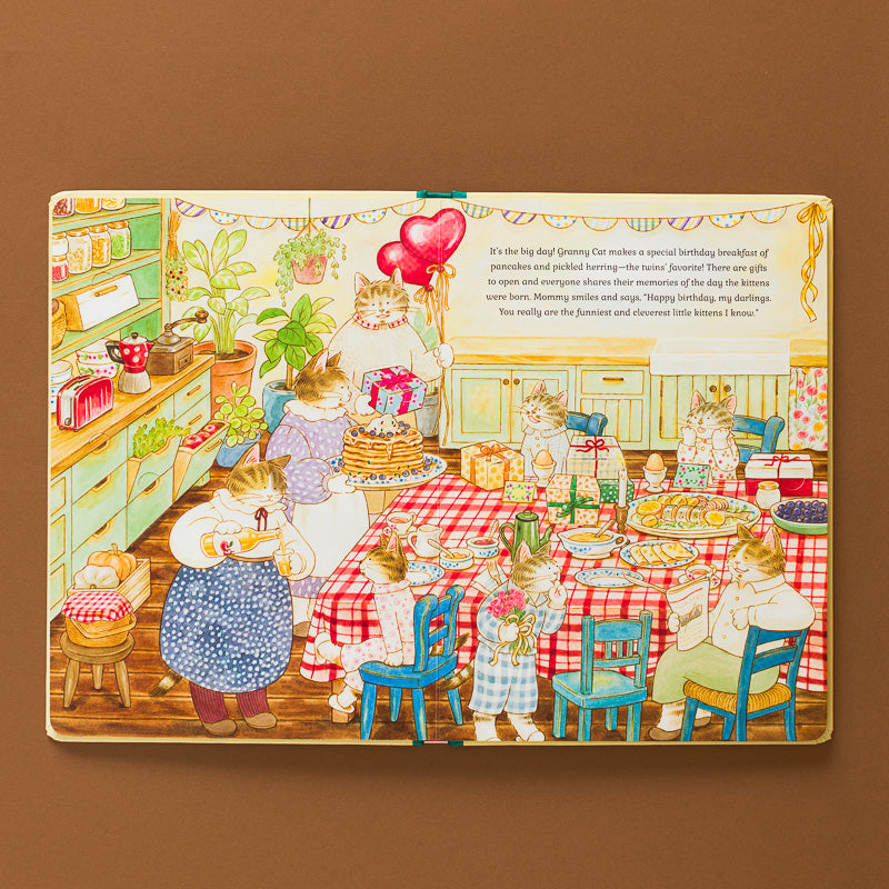 Cat-Family-Birthday-A-Life-the-Flap-Book illustration of family in kitchen
