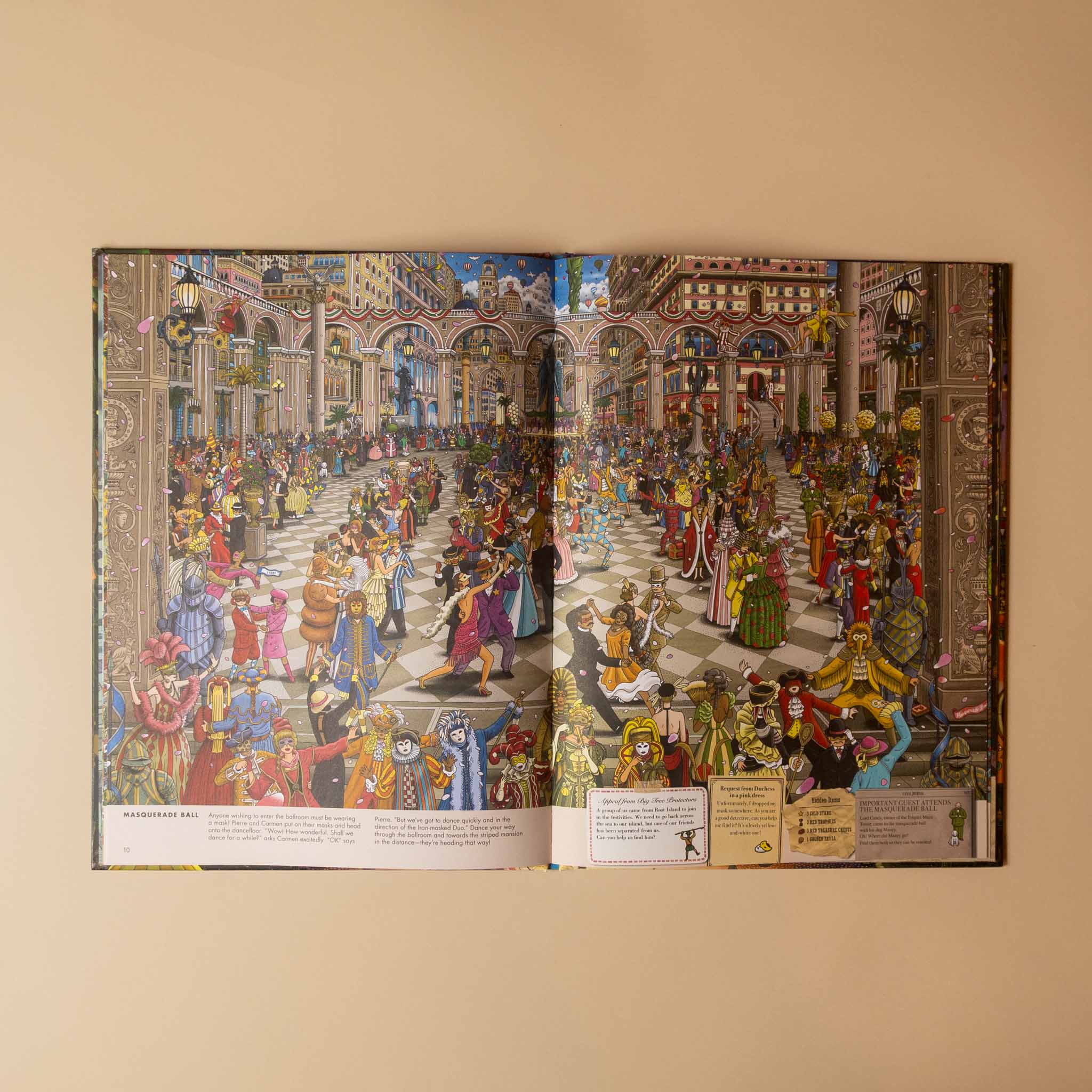 An open illustrated book or art print laid flat on a beige surface, showing a highly detailed historical street scene with many figures, buildings, and decorative elements. Small text panels appear along the bottom of both pages.