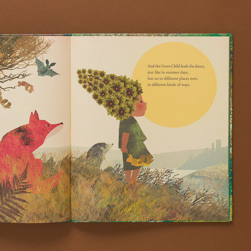 The-Green-Child-Book open page to child looking at the sun