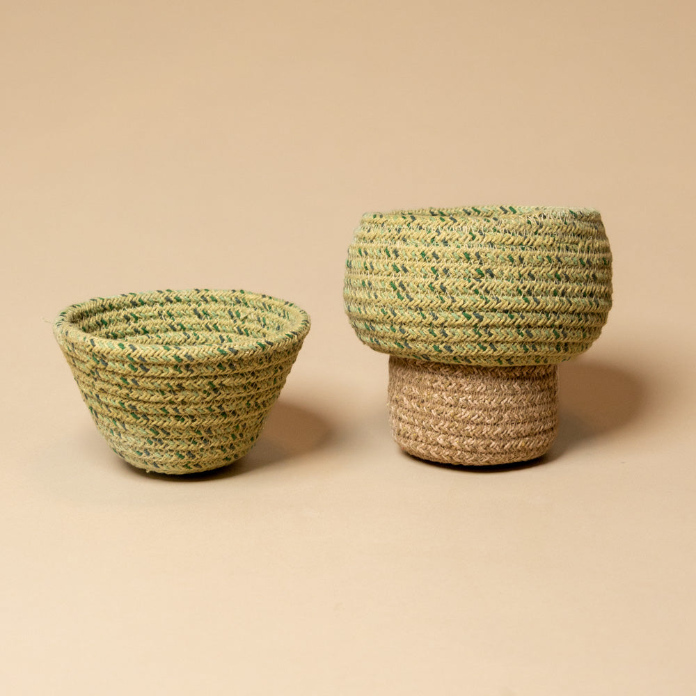 Tree-Basket---Small Two woven baskets, one larger and one smaller, on a beige background