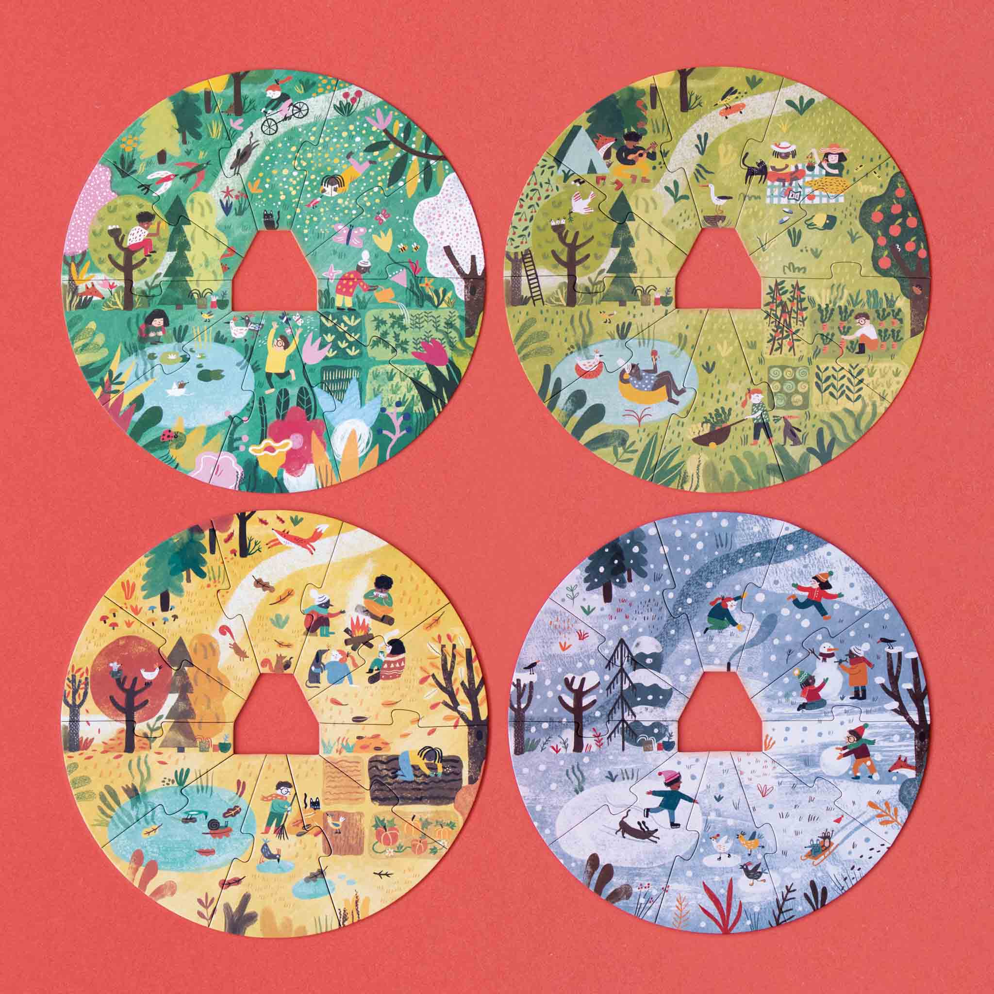 a-home-for-nature-layered-puzzle-box-with-people-playing-in-the-snow-on-one-layer-spring-garden-in-another-each-of-the-4-seasons-are-shown