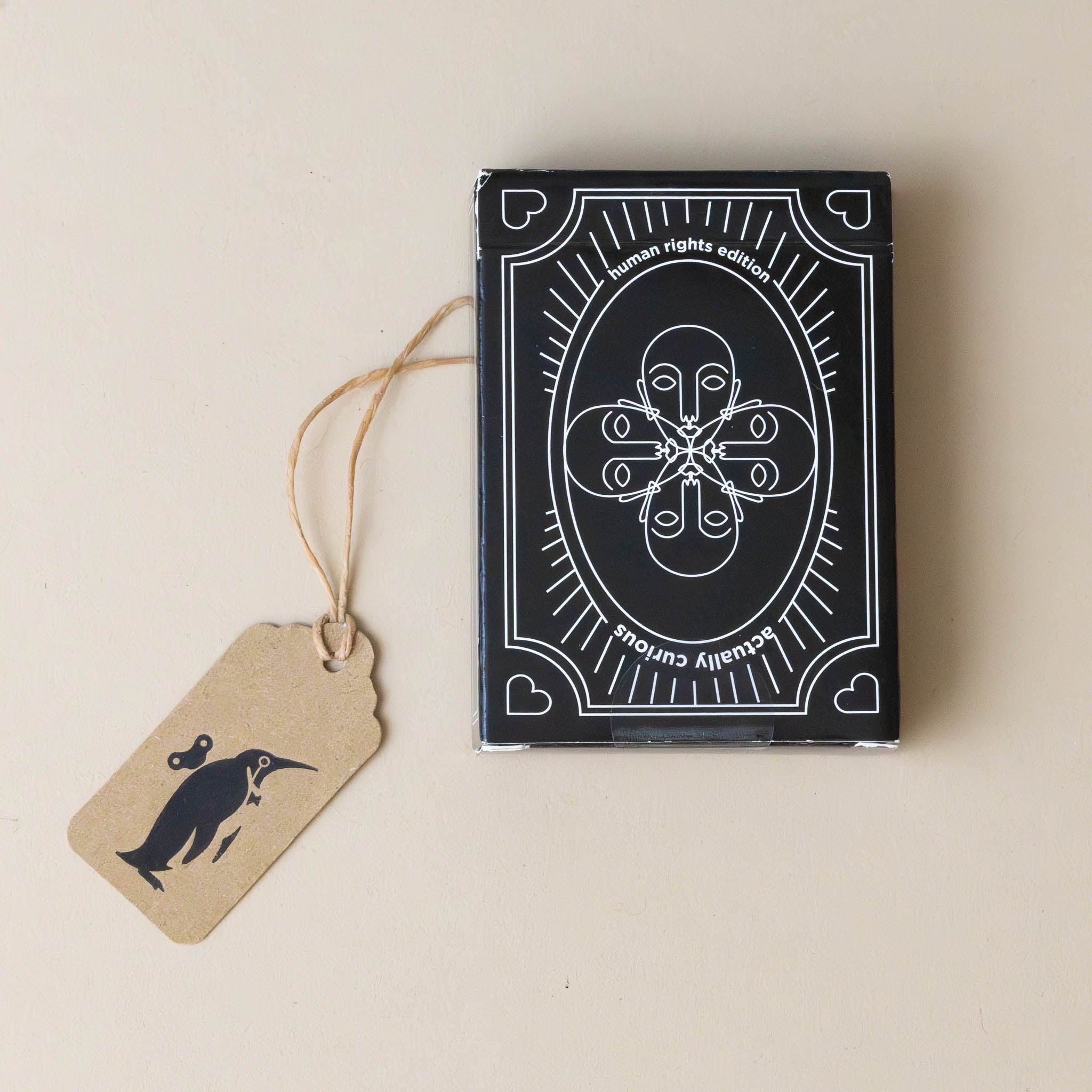 actually-curious-game-human-rights-edition-black-box-with-white-illustration-of-faces