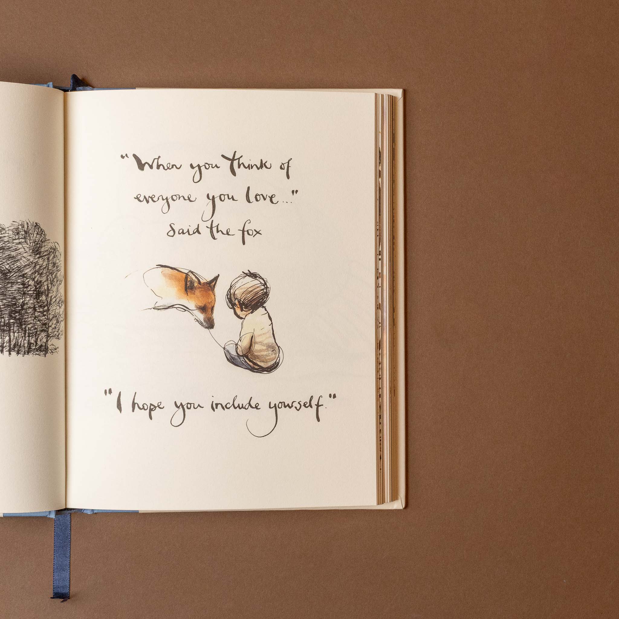 Open always-remember-book with illustration of a fox and a child, and accompanying text on a brown background