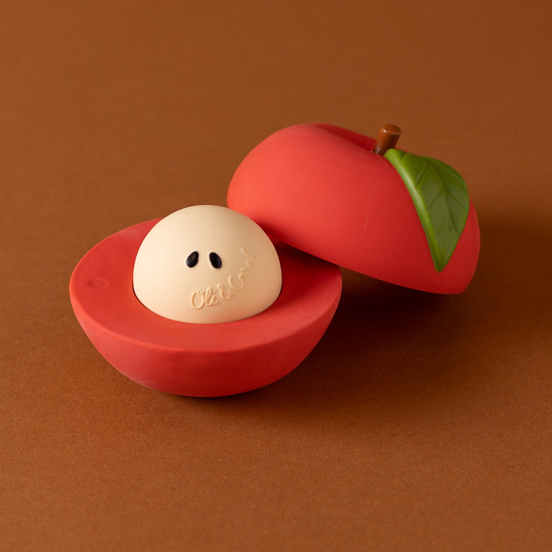 apple-stack-and-roll red toy with whte center