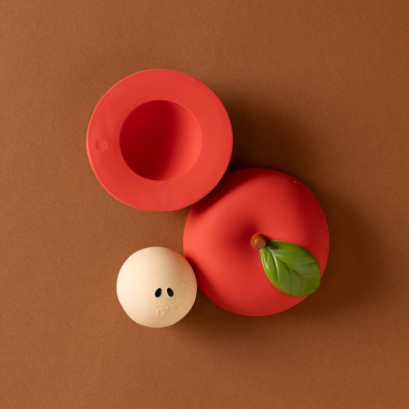 apple-stack-and-roll red toy with whte center