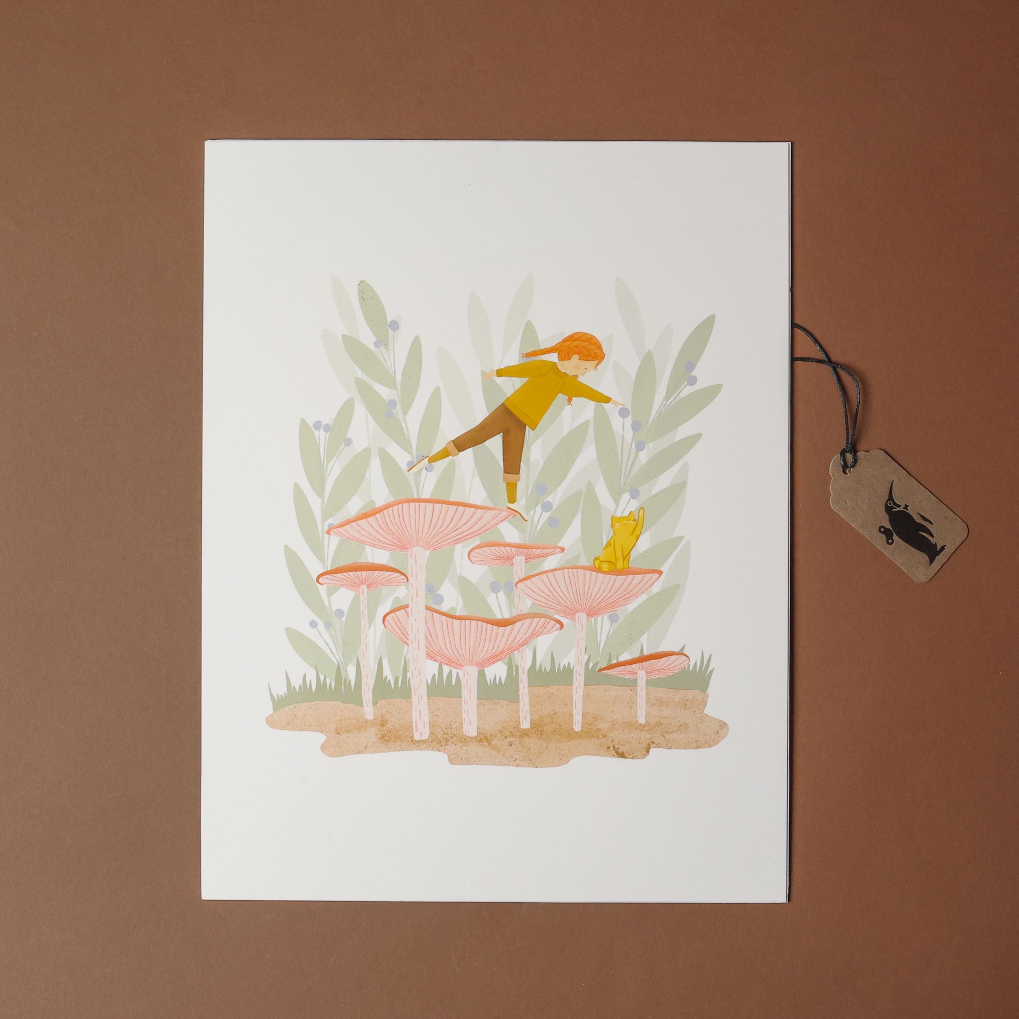 art-print-mushroom-hopping -a person and cat on a mushroom with plants and in the background, on a white card with a brown border.