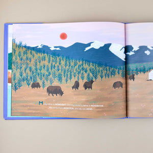 open-book-page-showing-illustration-of-bison-family-ini-front-of-mountains-and-forest