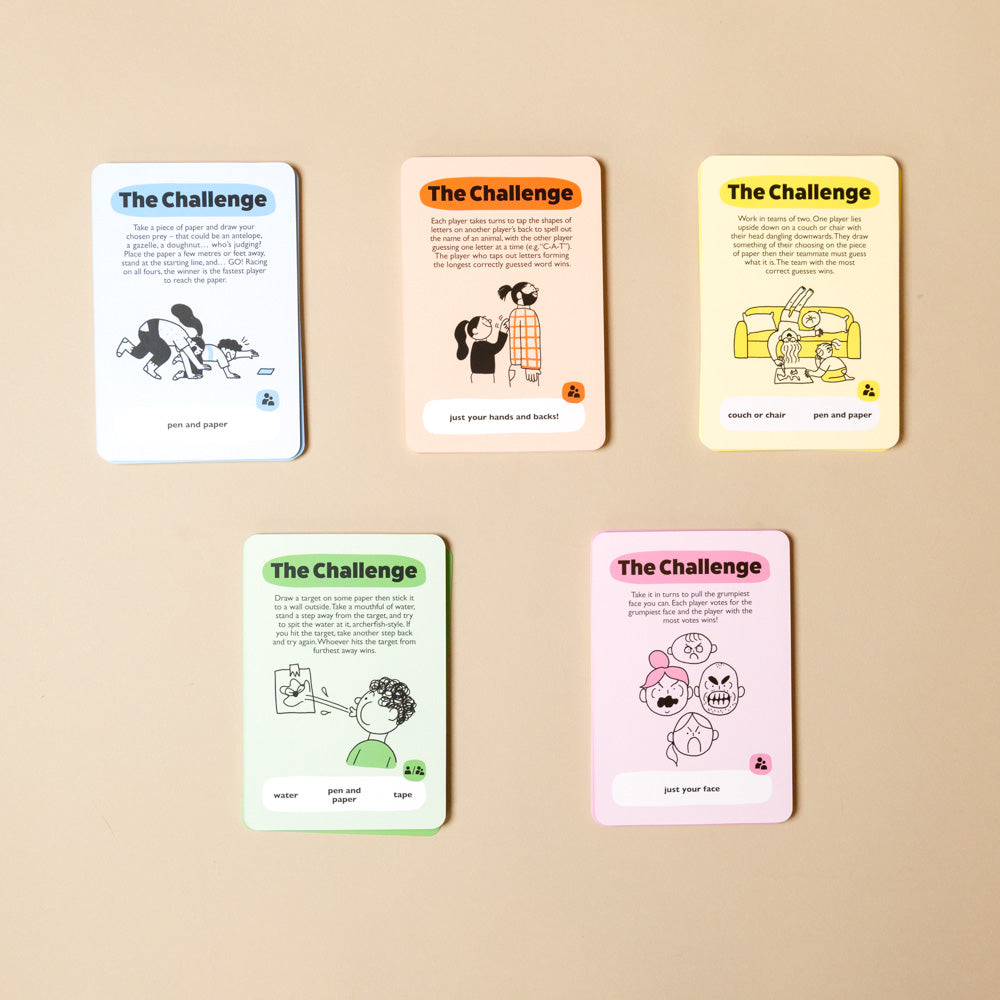 beat-the-cheetah-50-animal-inspired-challenges Set of 'The Challenge' cards with illustrations on a beige background