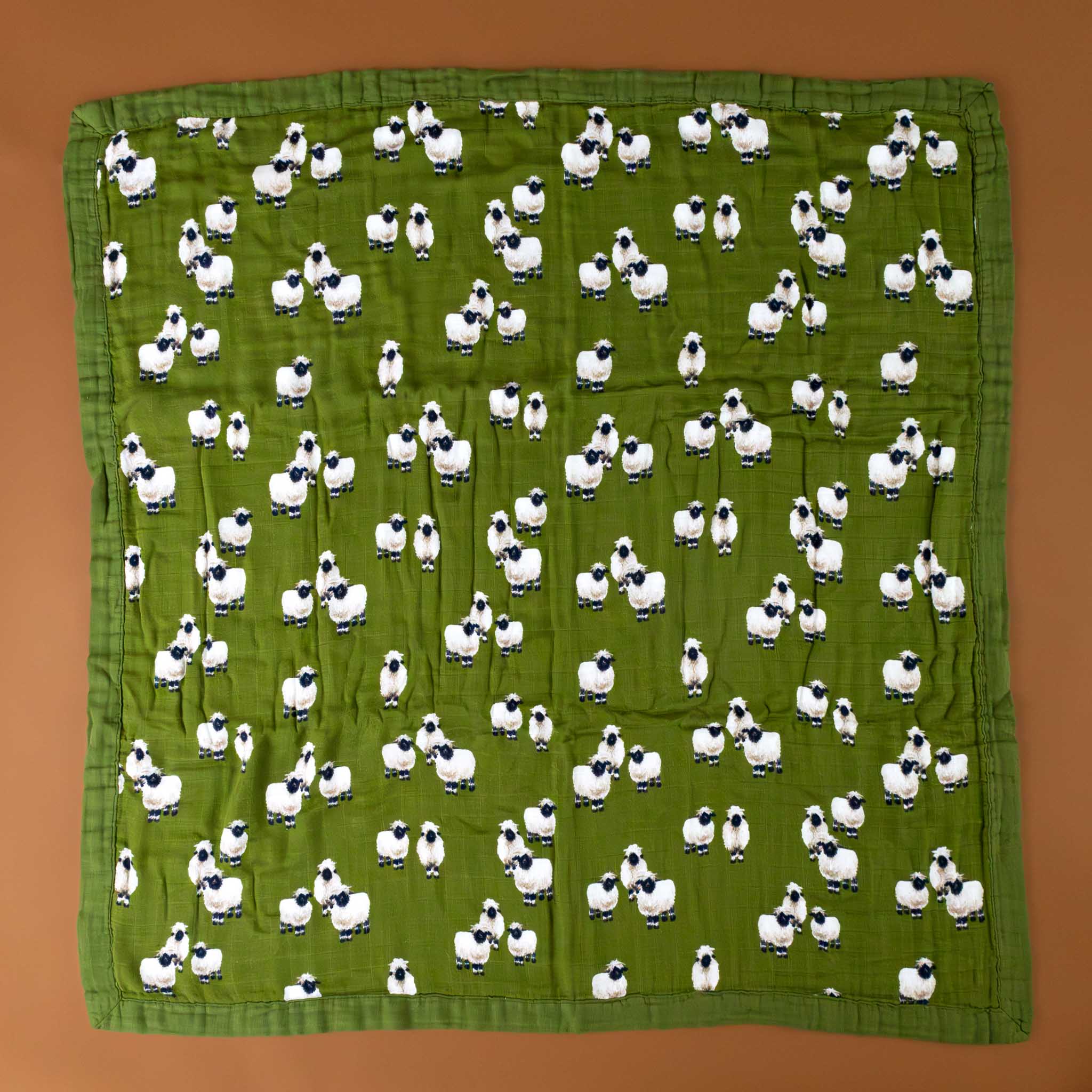 square-folded-big-lovie-in-dark-green-with-valais-sheep-pattern