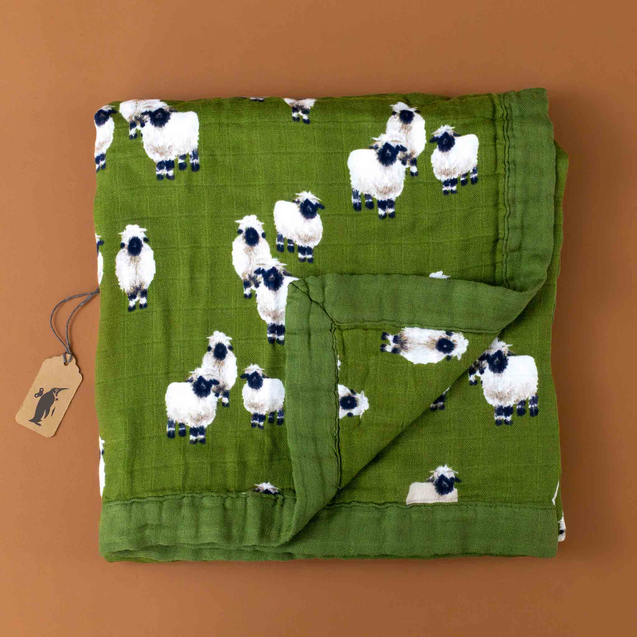 square-folded-big-lovie-in-dark-green-with-valais-sheep-pattern
