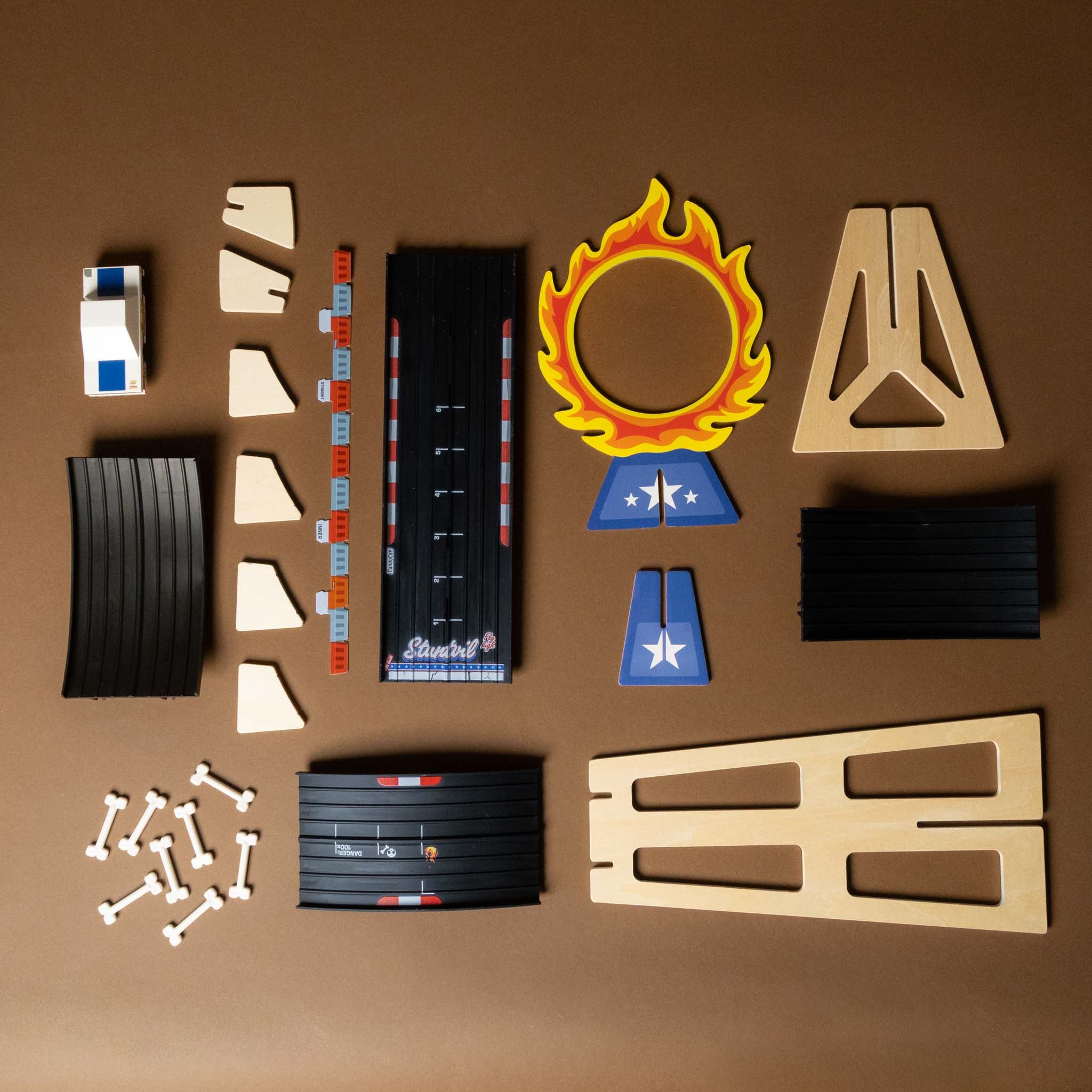 Collection of candycar-play-set-jump building parts on a brown background