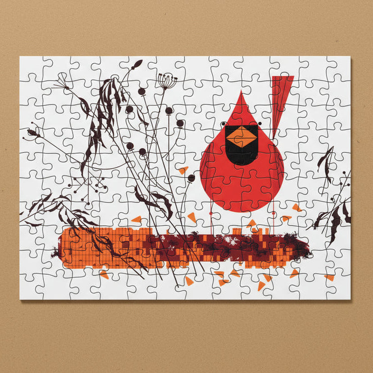 Jigsaw puzzle with a red bird and abstract shapes on a white background