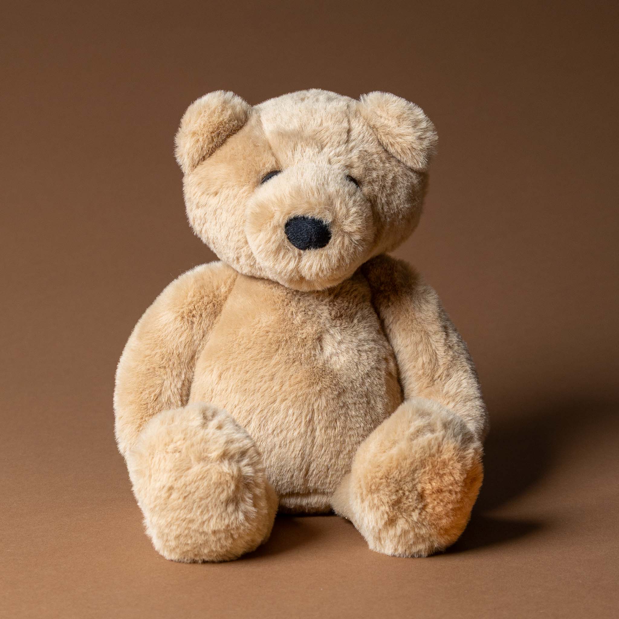 charlie-the-bear-oatmeal Plush teddy bear on a brown background