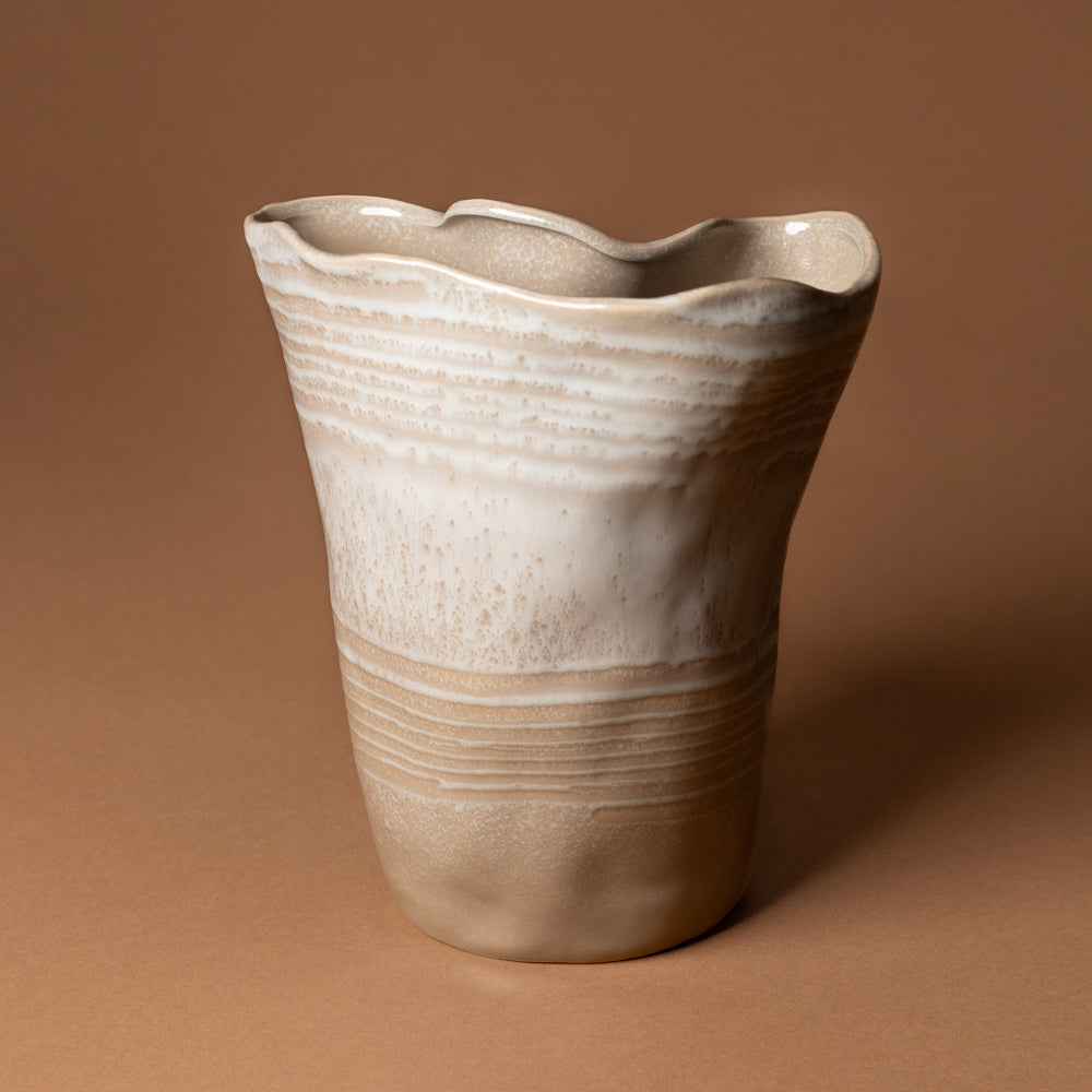 claribel-vase-tall Ceramic vase with wavy design on a brown background