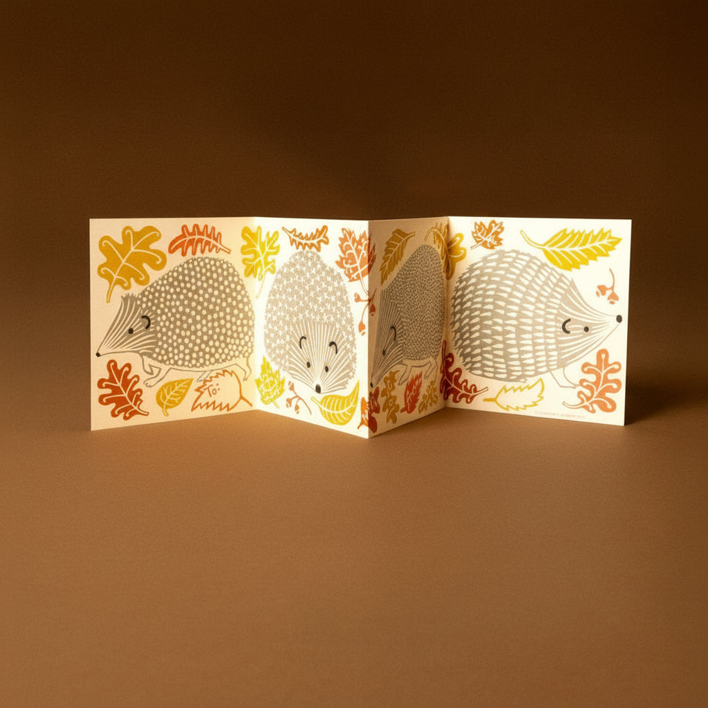 Folded concertina-greeting-card--prickle-of-hedgehogs illustrations on a brown background