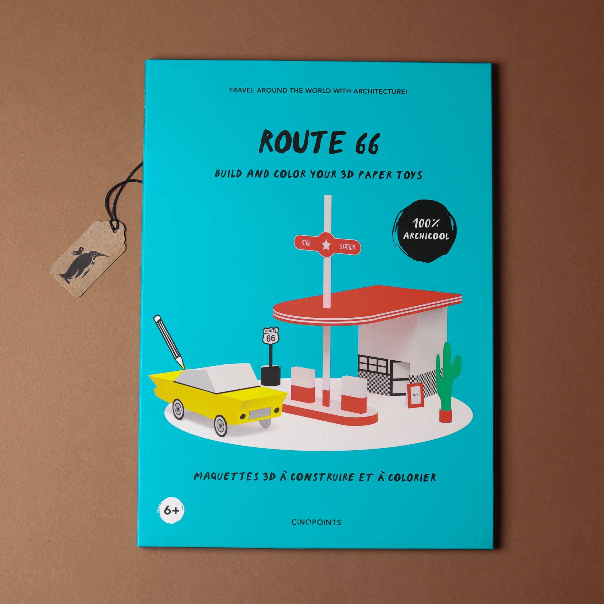 kit cover of 'Route 66' with a yellow truck, gas station, and cactus on a blue background.