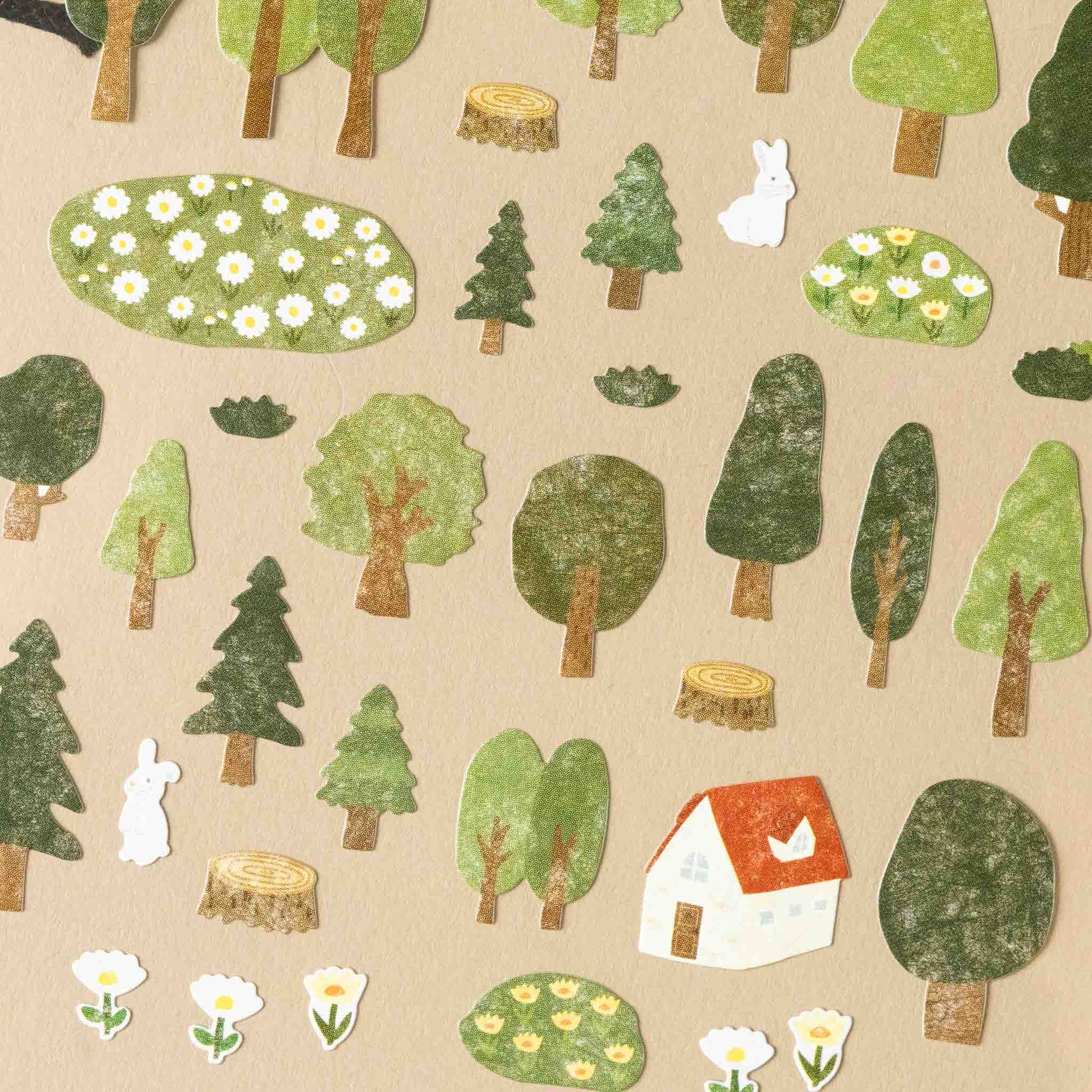 deco-sticker-sheet-forest of trees, flowers, and a house on a beige background