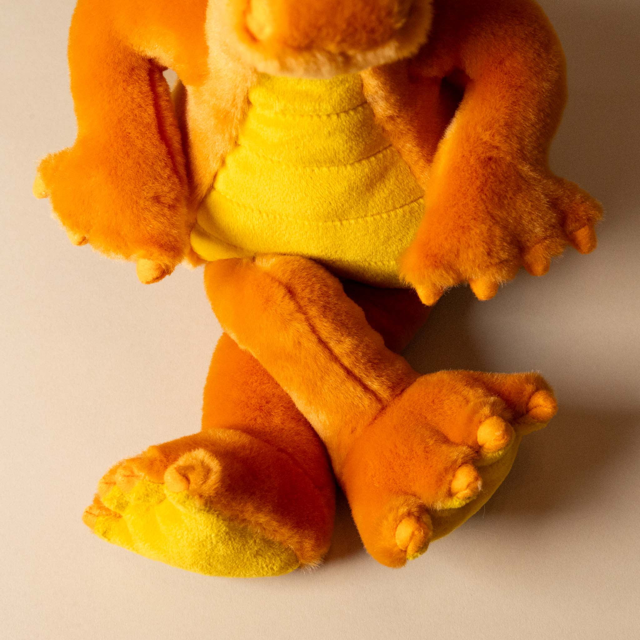 diamonds-the-sun-dragon-stuffed-animal-crossed-legs