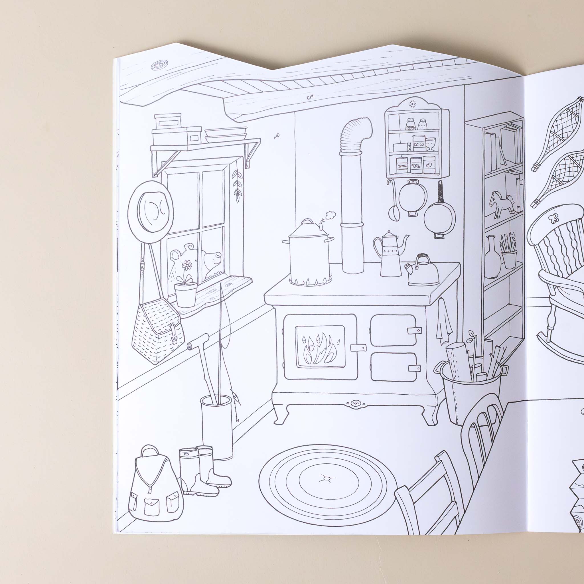 explore-the-world-coloring-and-sticker-book-interior-page-with-a-scene-of-a-cabin