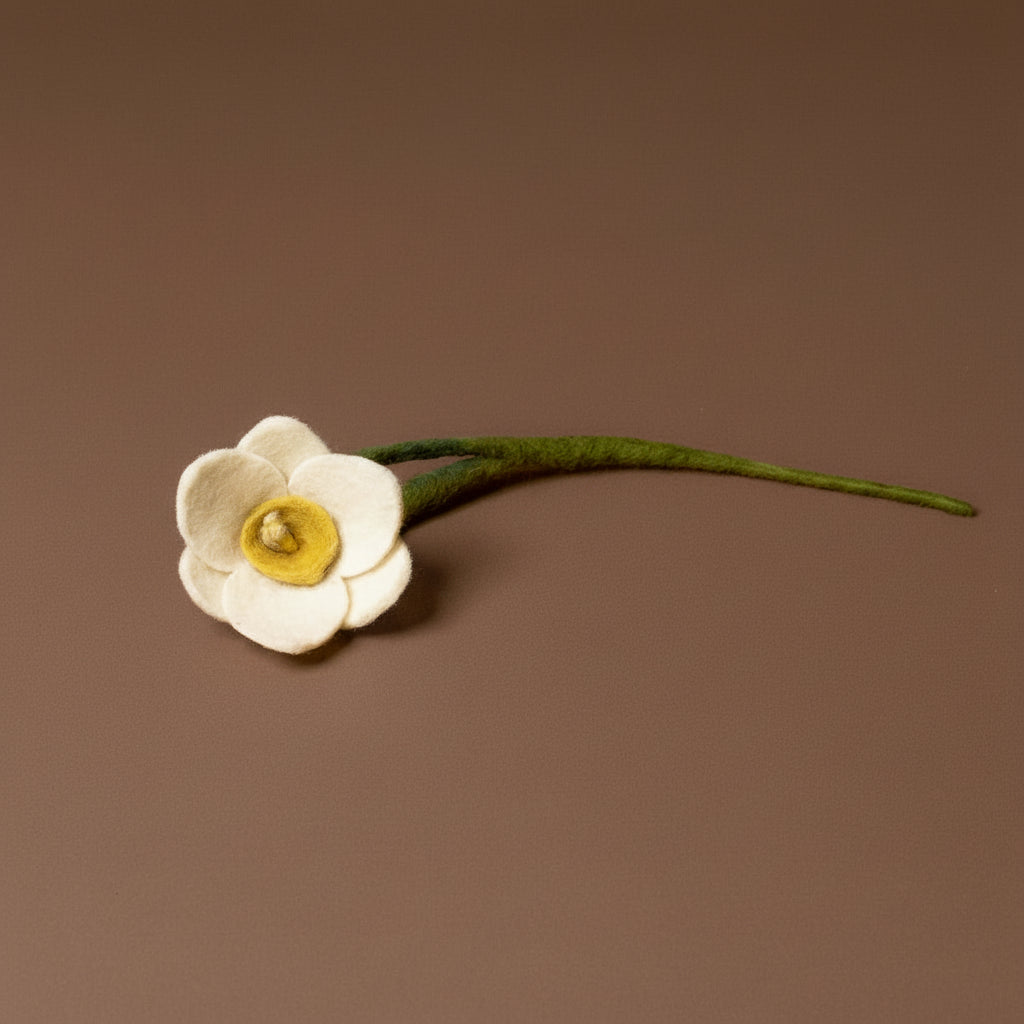 felt-daffodil-stem-white with a yellow center on a brown background