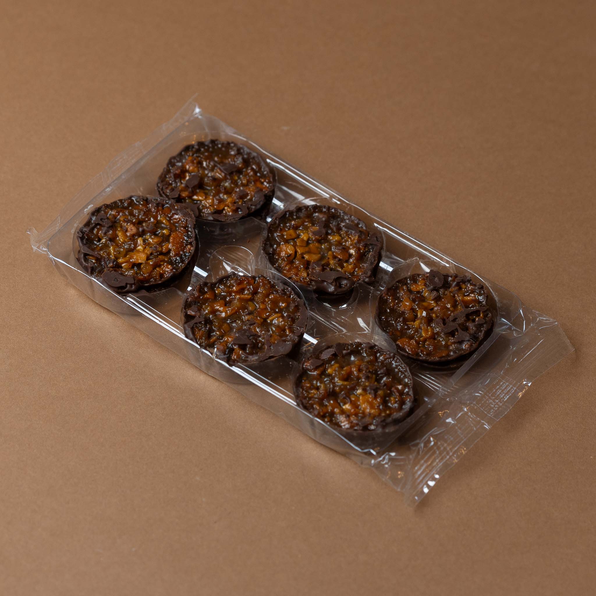 florentins-gift-box-dark-chocolate-with-orange Packaged cookies on a brown background
