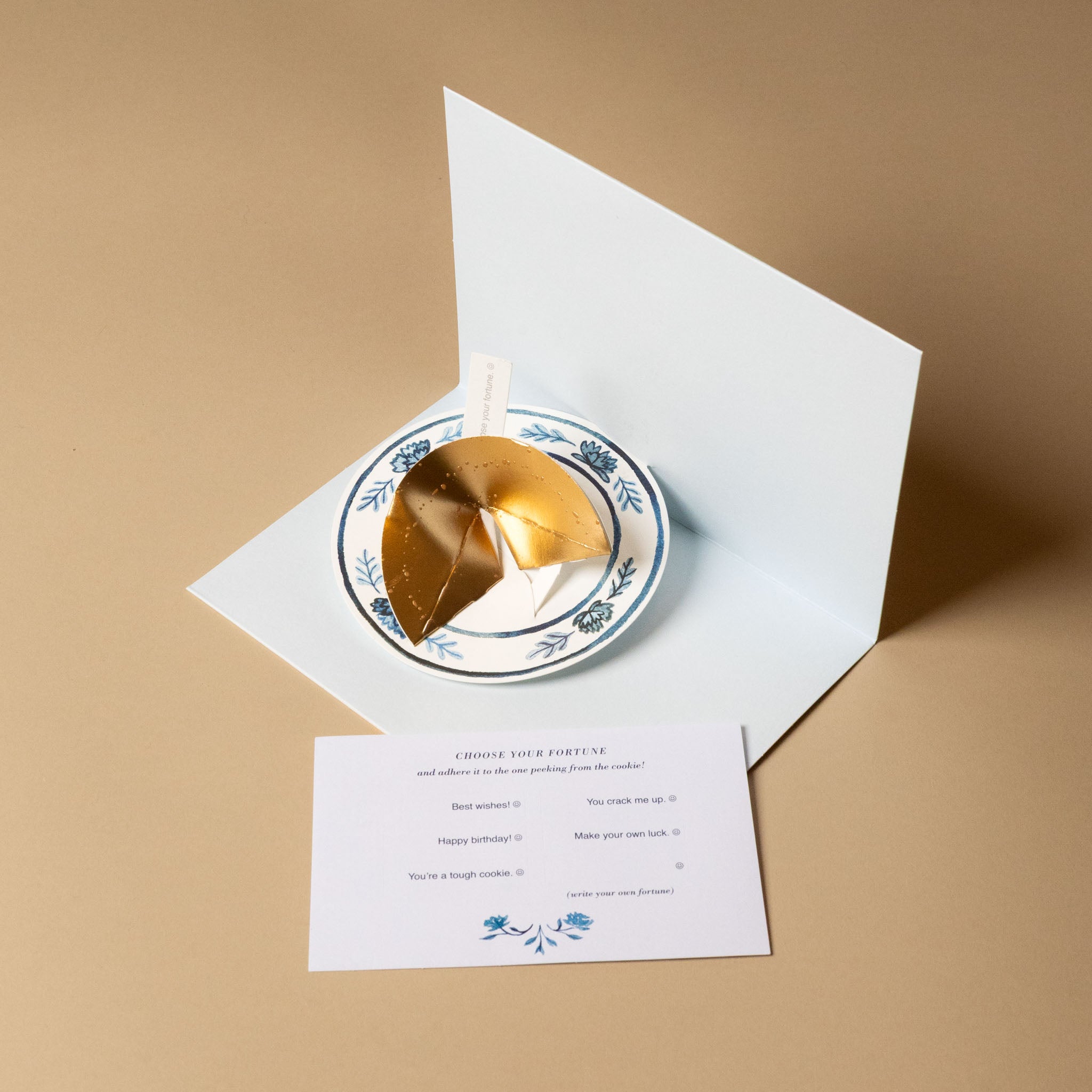 Fortune cookie with a card on a beige background- with-optional-sentiments