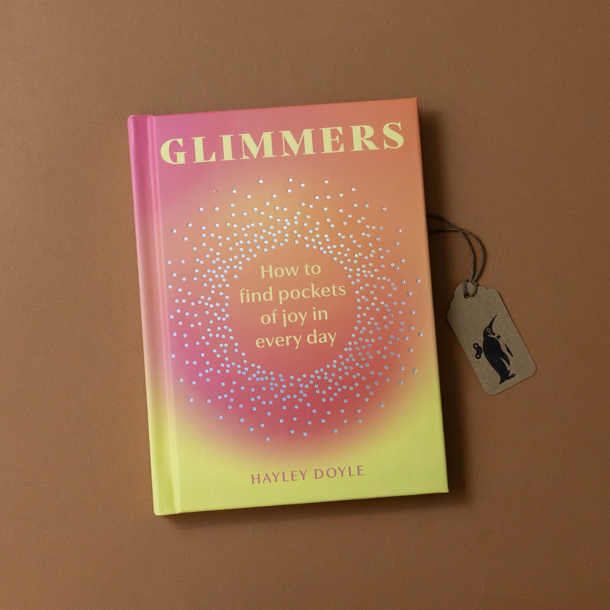 glimmers-how-to-find-pockets-of-joy-in-your-everyday-cover-with-sunrise-colored-background