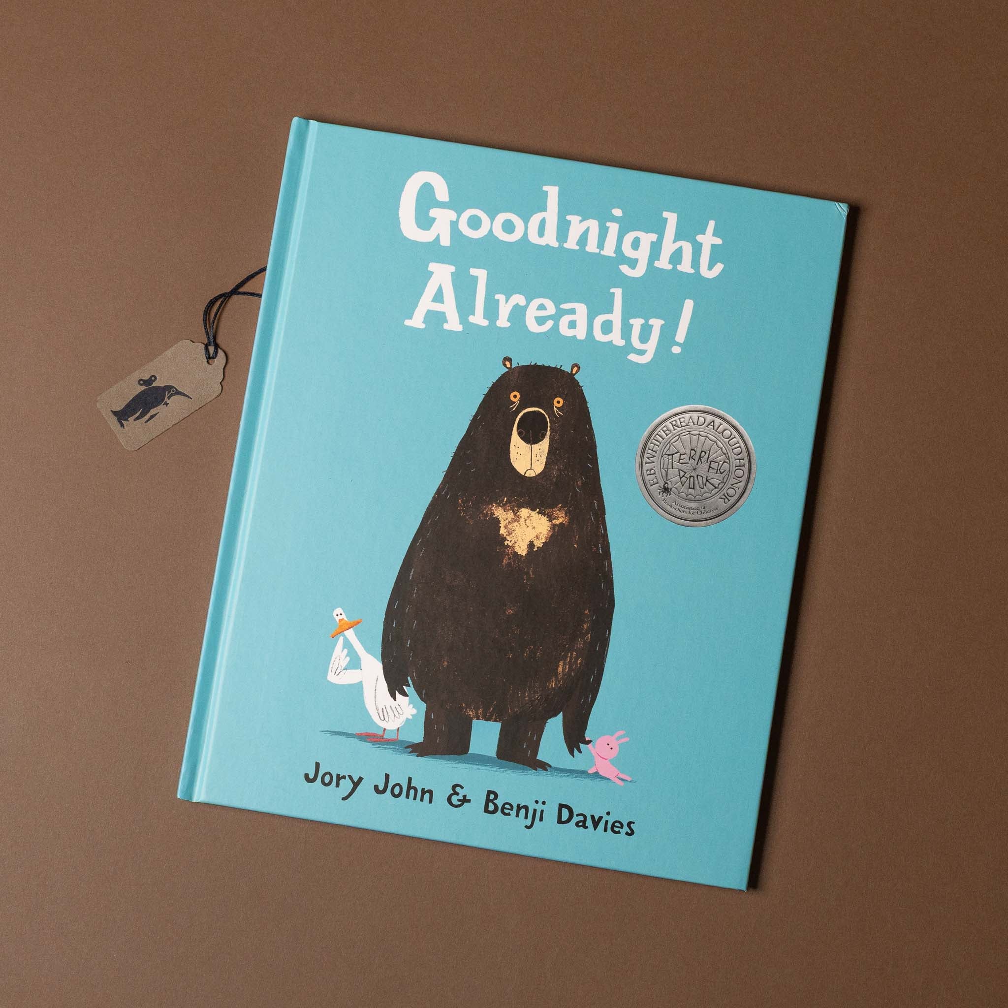 Children's book titled 'Goodnight Already!' with a bear illustration on a brown background