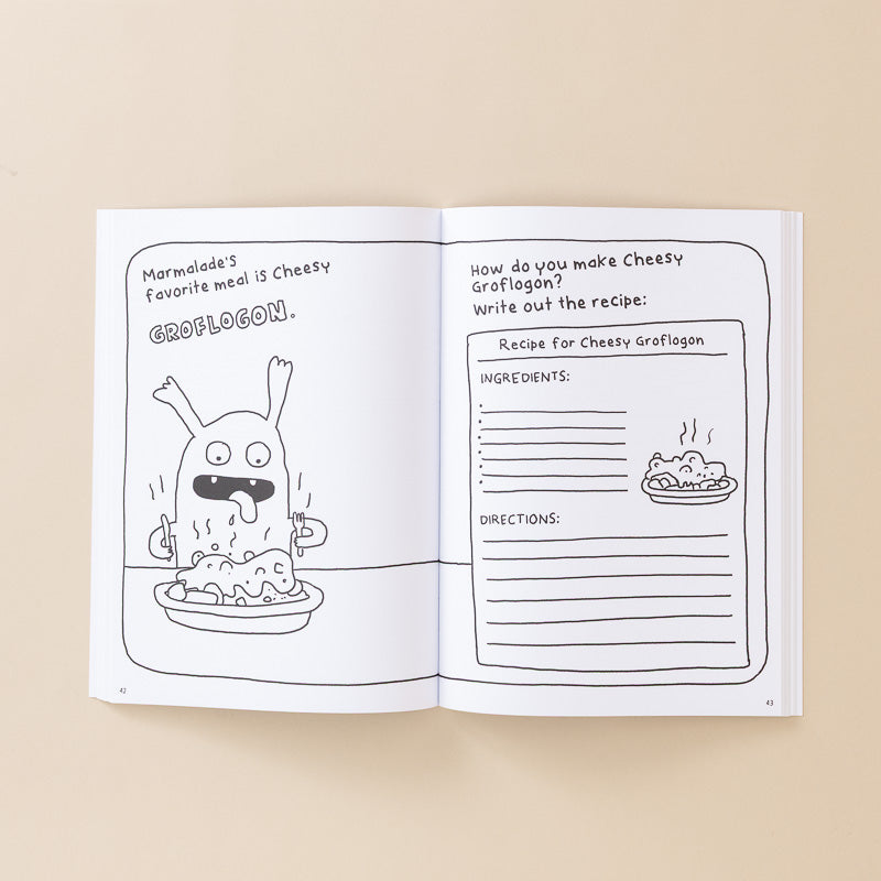 An open children's activity book or recipe booklet on a warm beige background. The pages are white with black line drawings and handwritten-style text, including a cartoon monster eating and a recipe box titled 'Recipe for Cheesy Grootlogon.