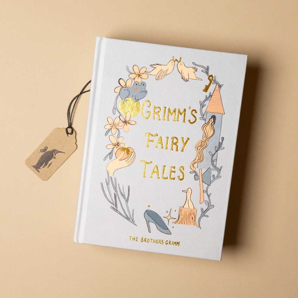 grimms-fairy-tales Book titled 'Grimm's Fairy Tales' with illustrations on a beige background