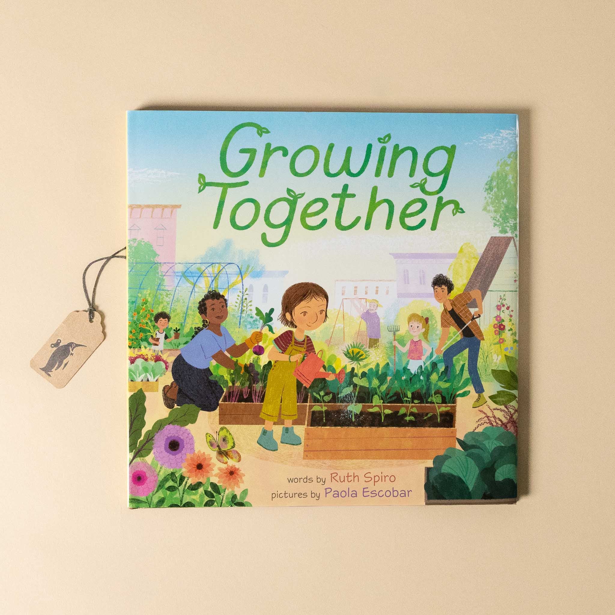 Book titled 'Growing Together' with illustrations of children gardening on a beige background