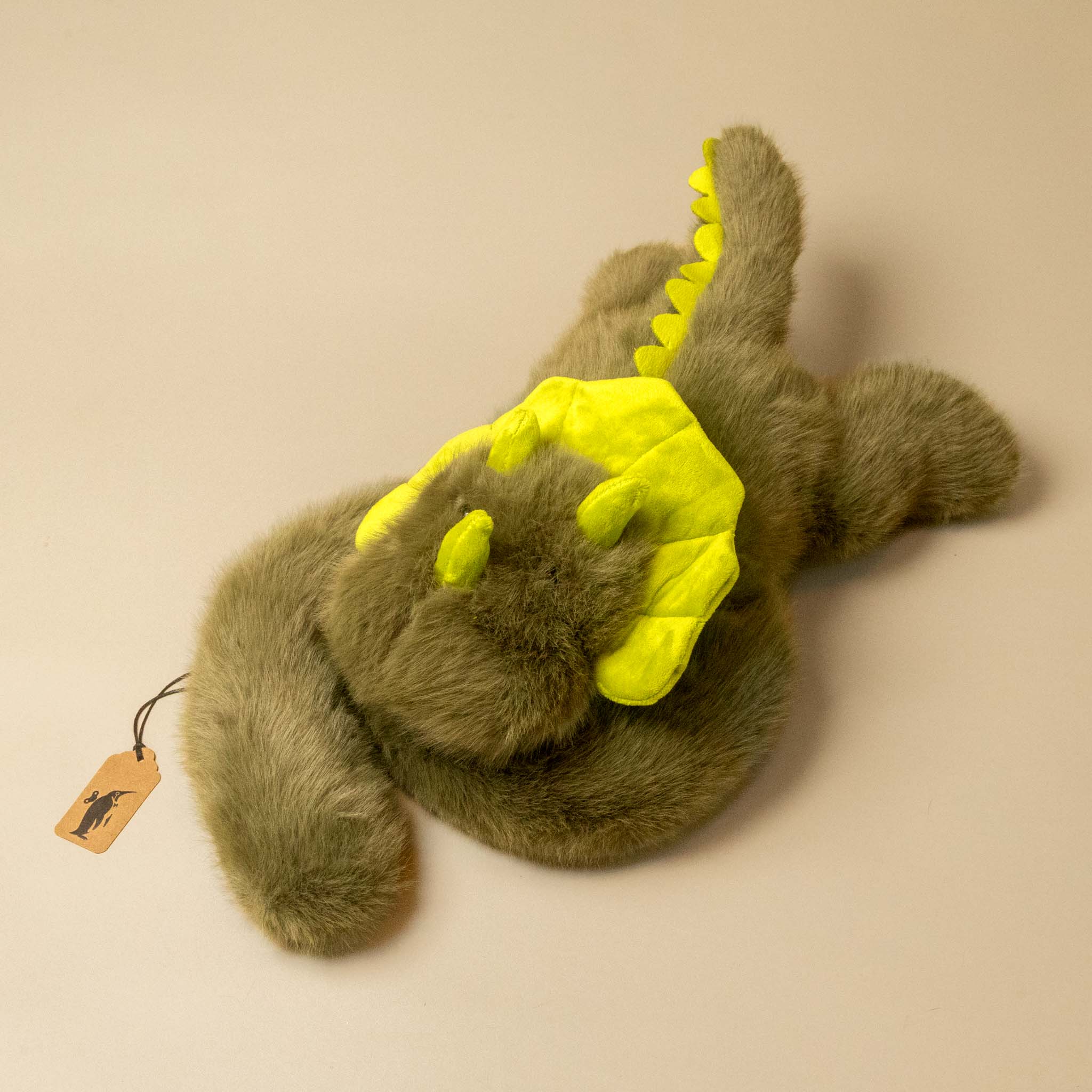 green weighted-dino stuffed animial