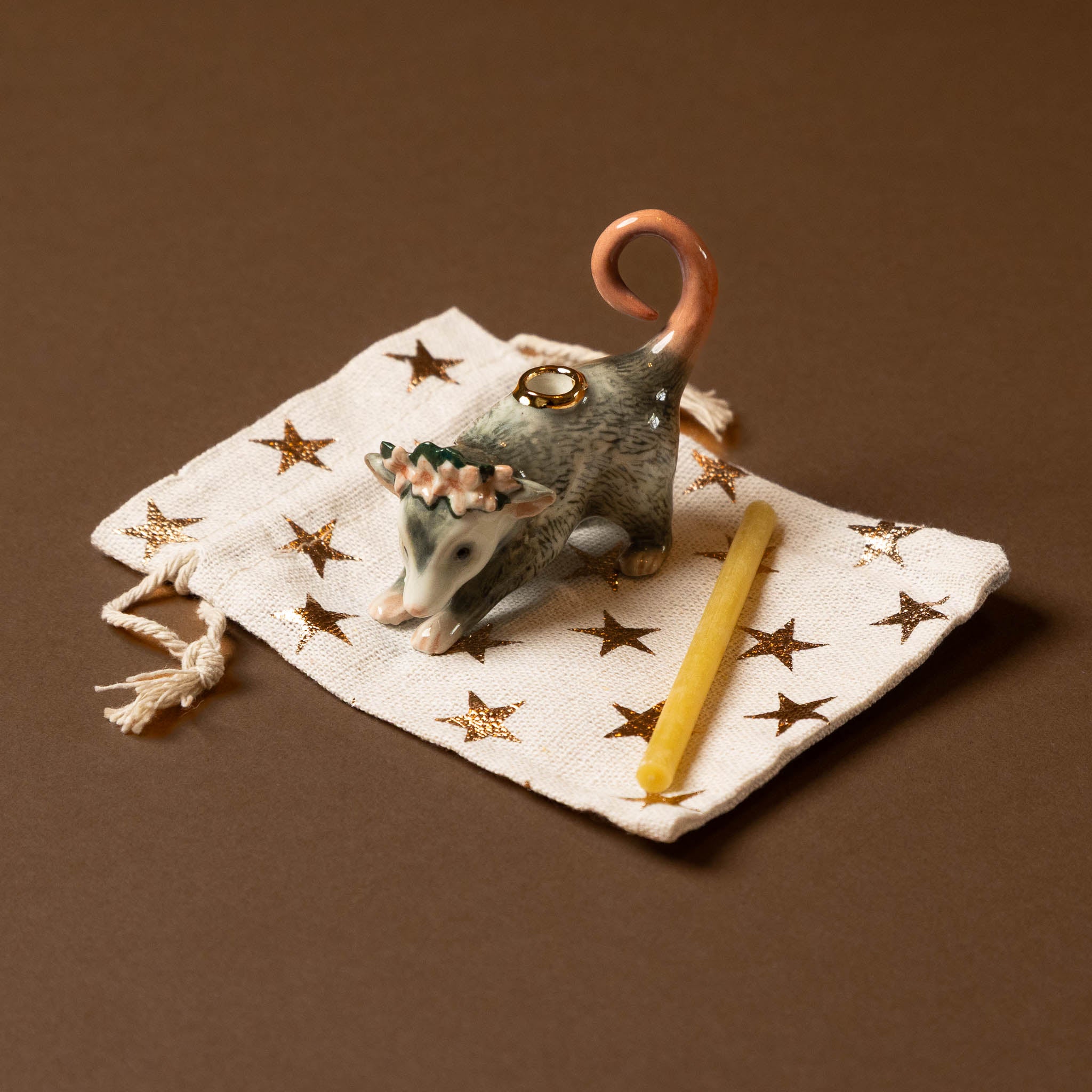 heirloom-porcelain-cake-topper-possum-bag-candle