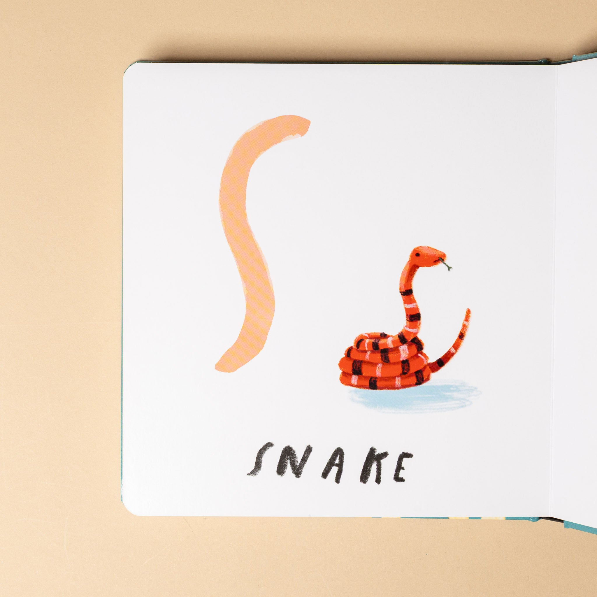 here-we-are--board-book-of-animals Children's book page with a red and black snake illustration on a beige background