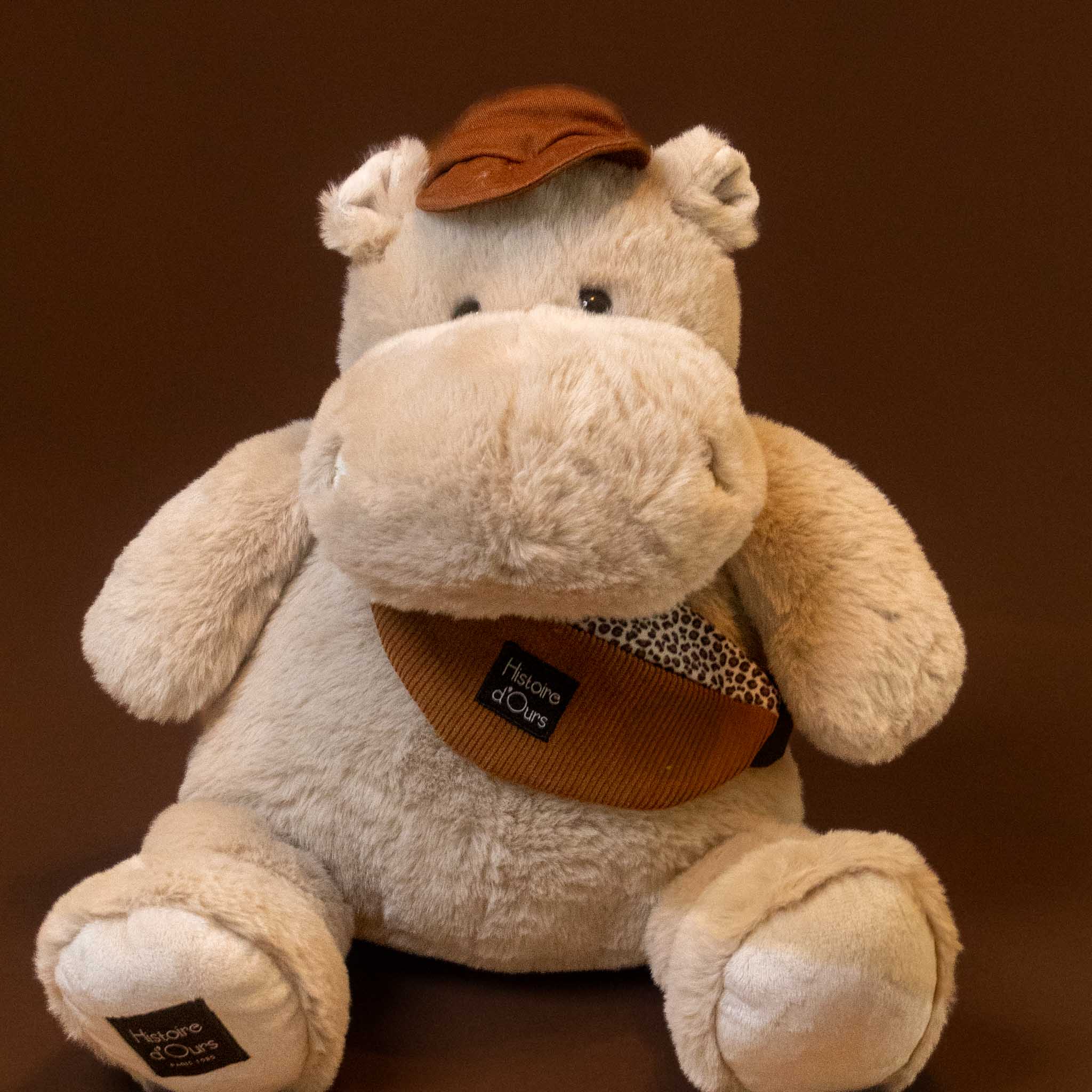 hip-hippo-world-traveler-grand with hat and bag stuffed animal