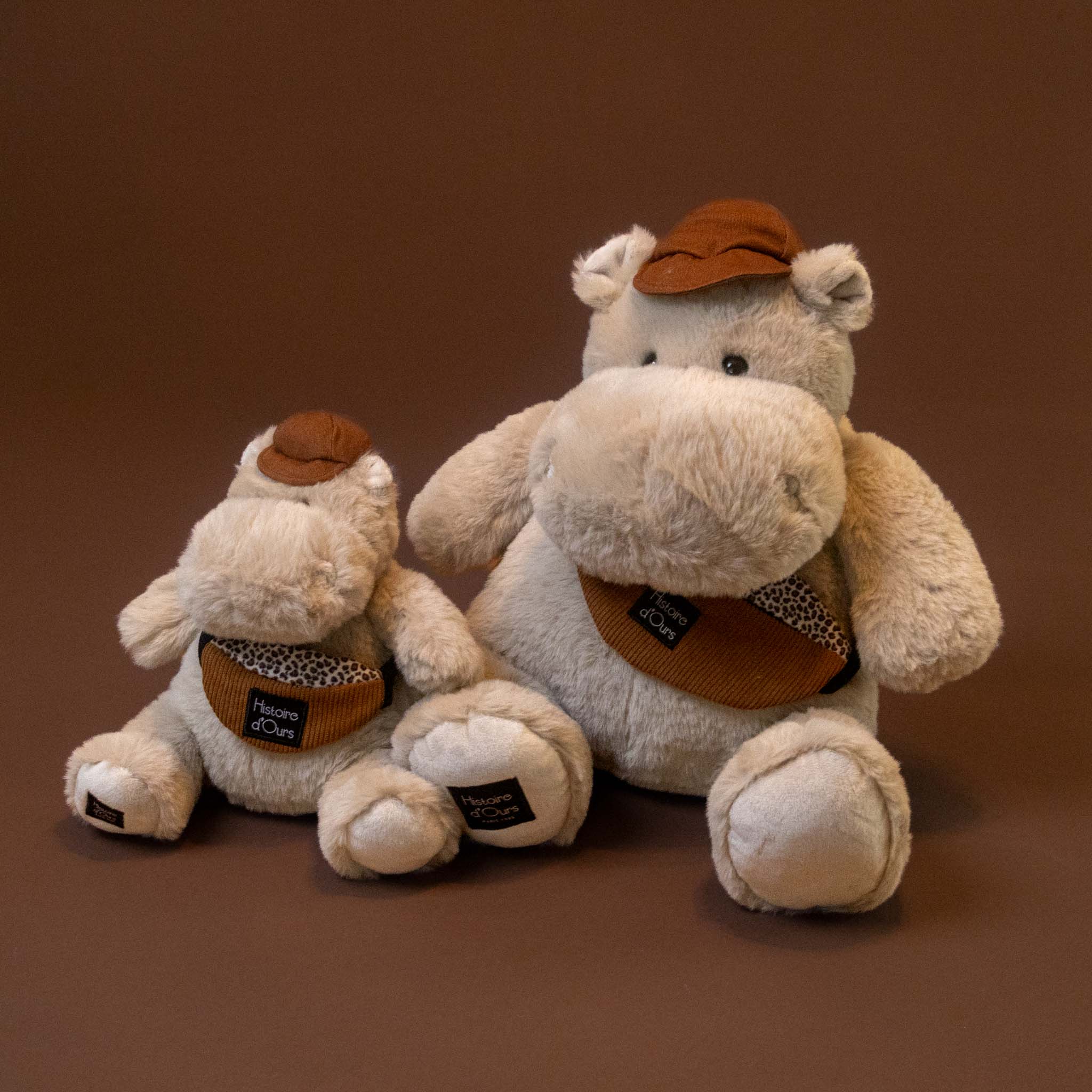 hip-hippo--world-traveler--grand-petit with bag and hat stuffed animal