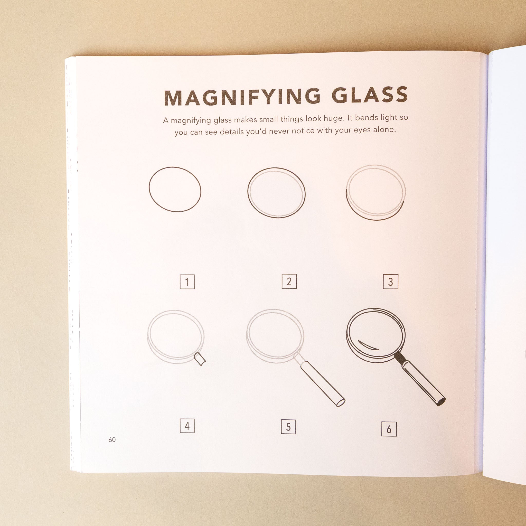 how-to-draw-bugs-for-kids-book page with illustrations of a magnifying glass and text about its use.