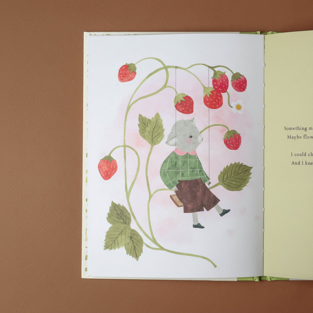 Illustration of a child in a green shirt and brown pants surrounded by strawberries on a page from a book.