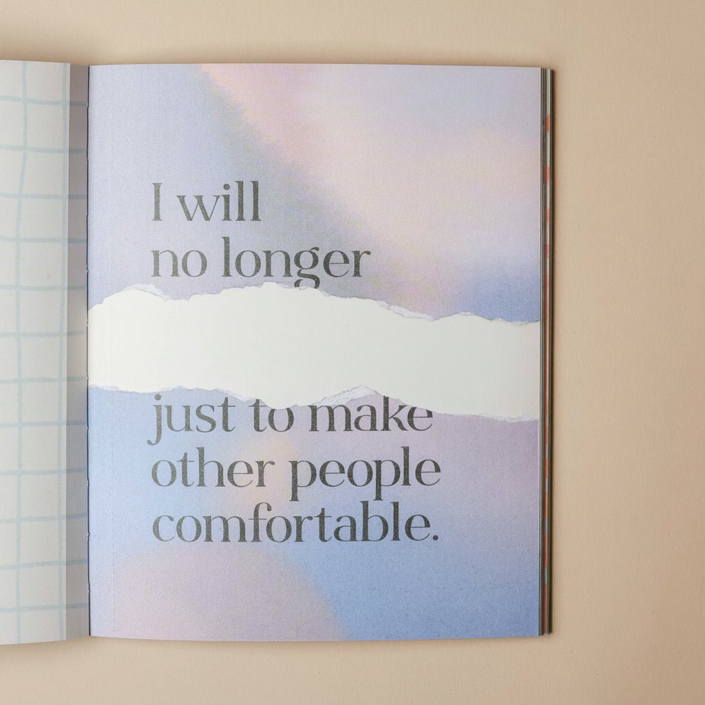 Open im-not-doing-that-any-more-book with motivational quote on a blurred landscape background