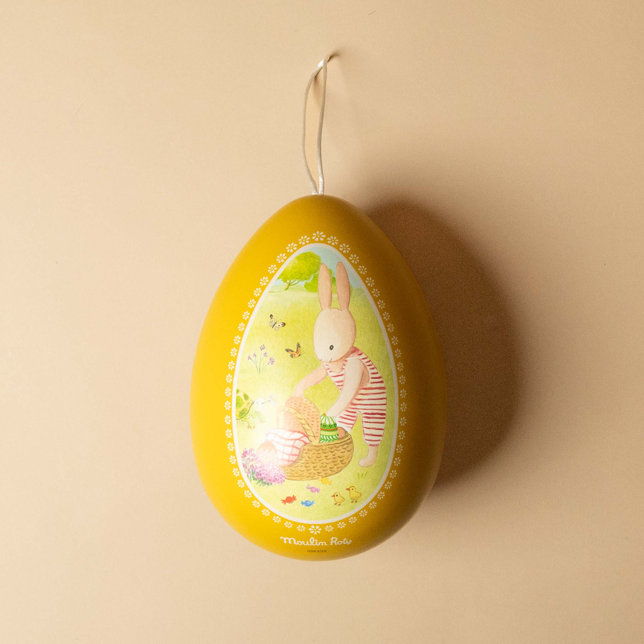 la-grande-famille-metal-hanging-easter-egg-yellow with a bunny design on a beige background