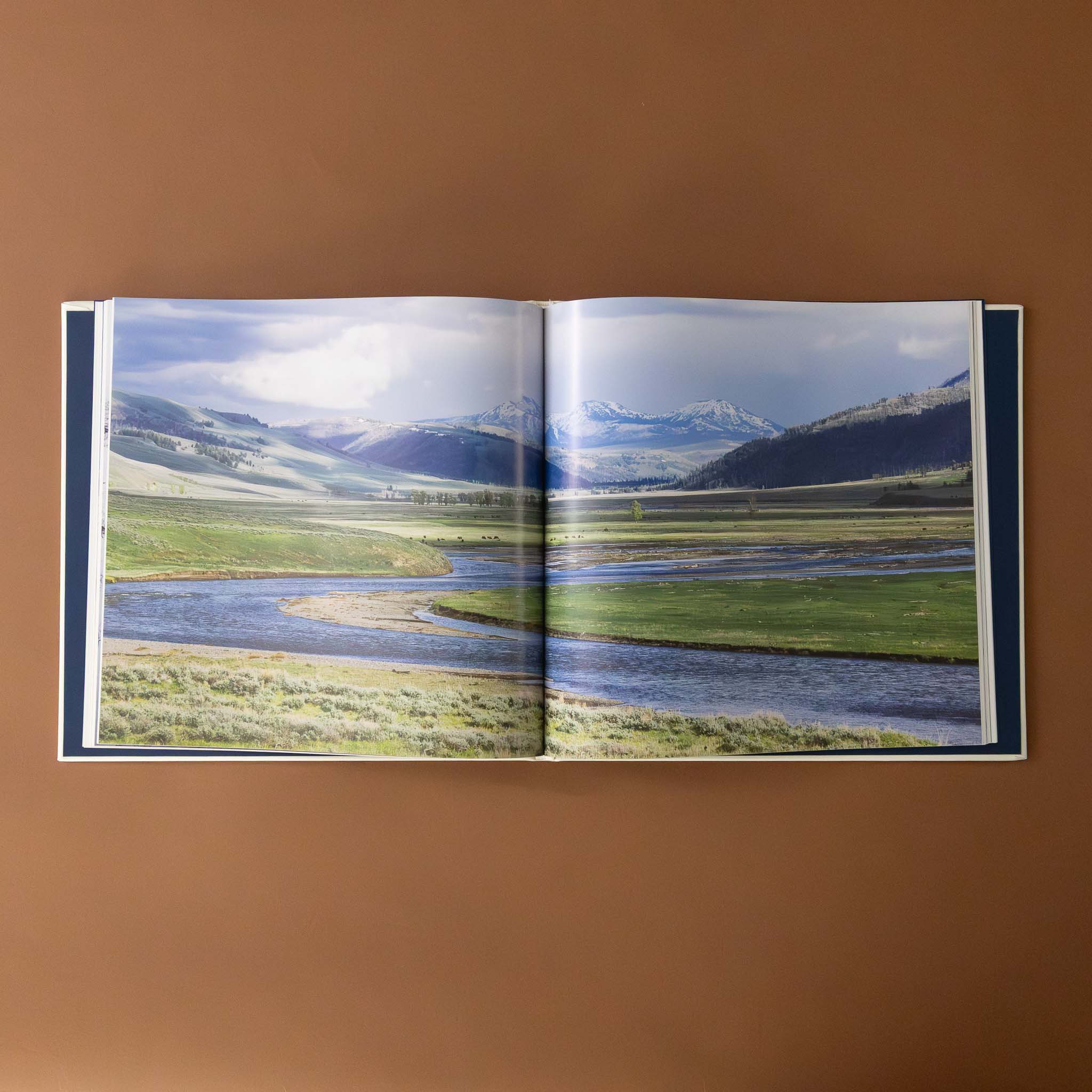 leather-bound-yellowstone-book-landscape-photo-of-river-and-mountain