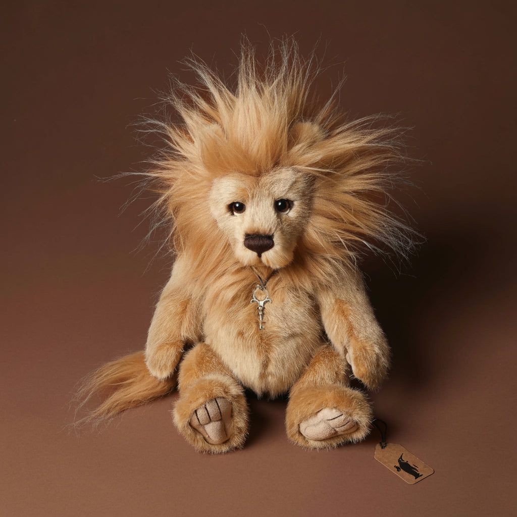Stuffed lion toy with a tag on a brown background