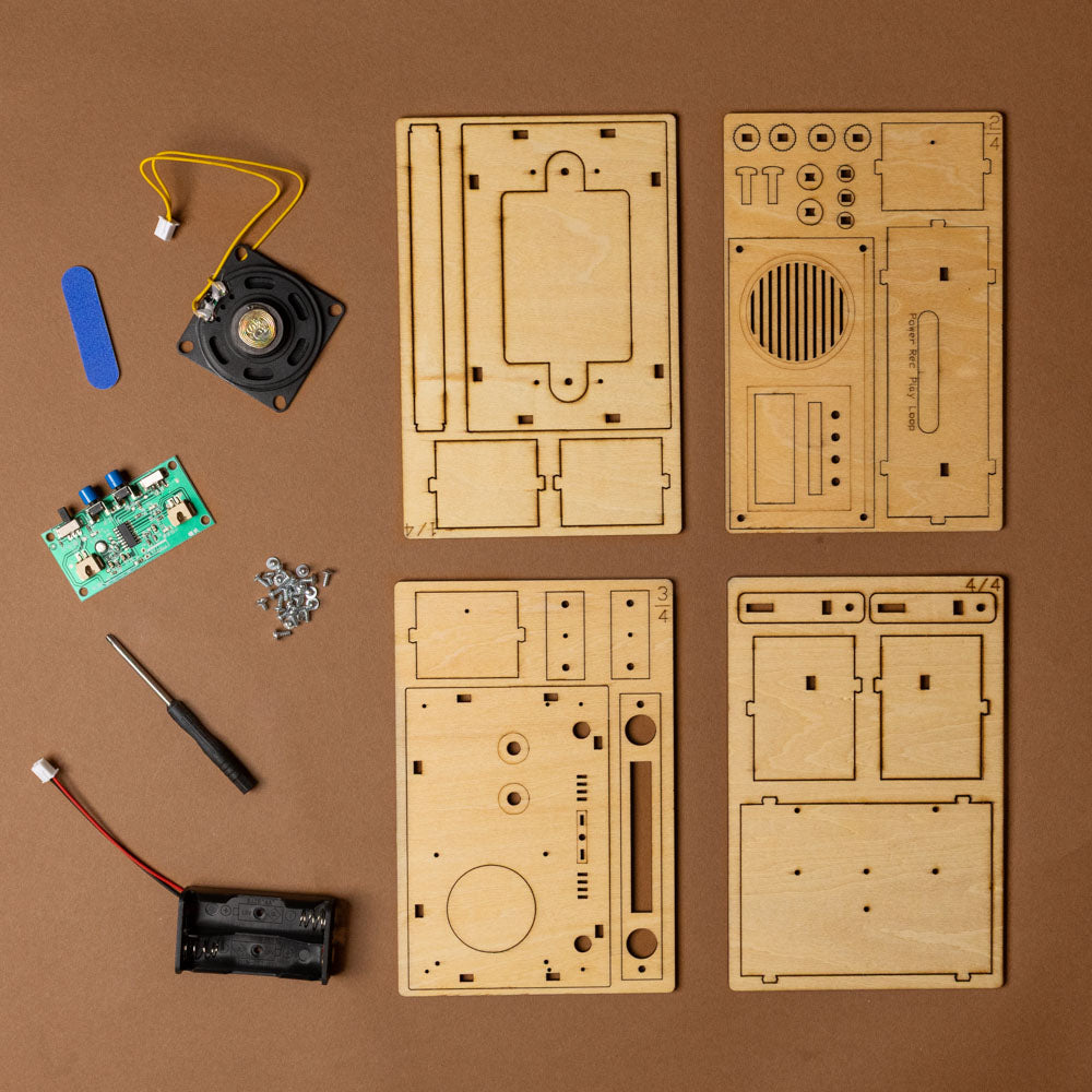 make-your-own-voice-recorder-kit Wooden electronic components and parts on a brown background