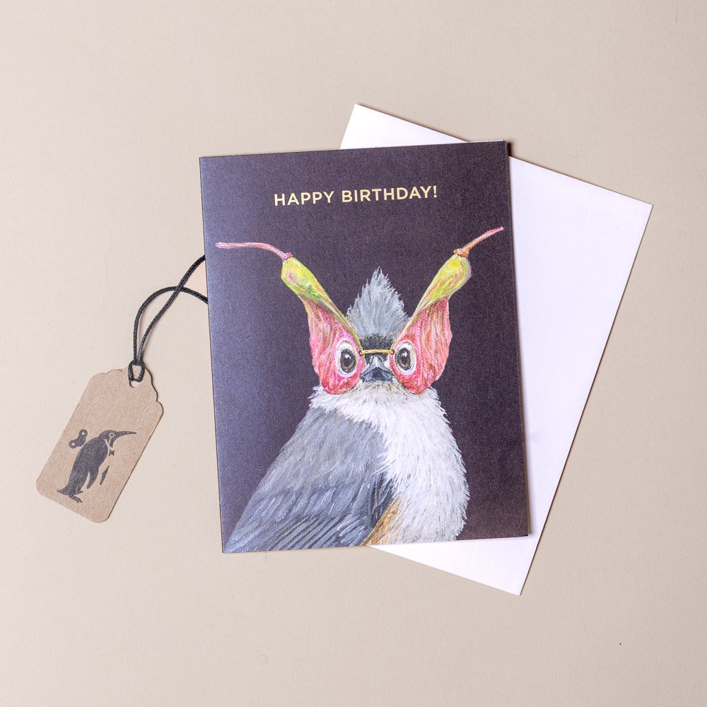 Birthday card with a bird illustration and 'Happy Birthday!' text on a beige background