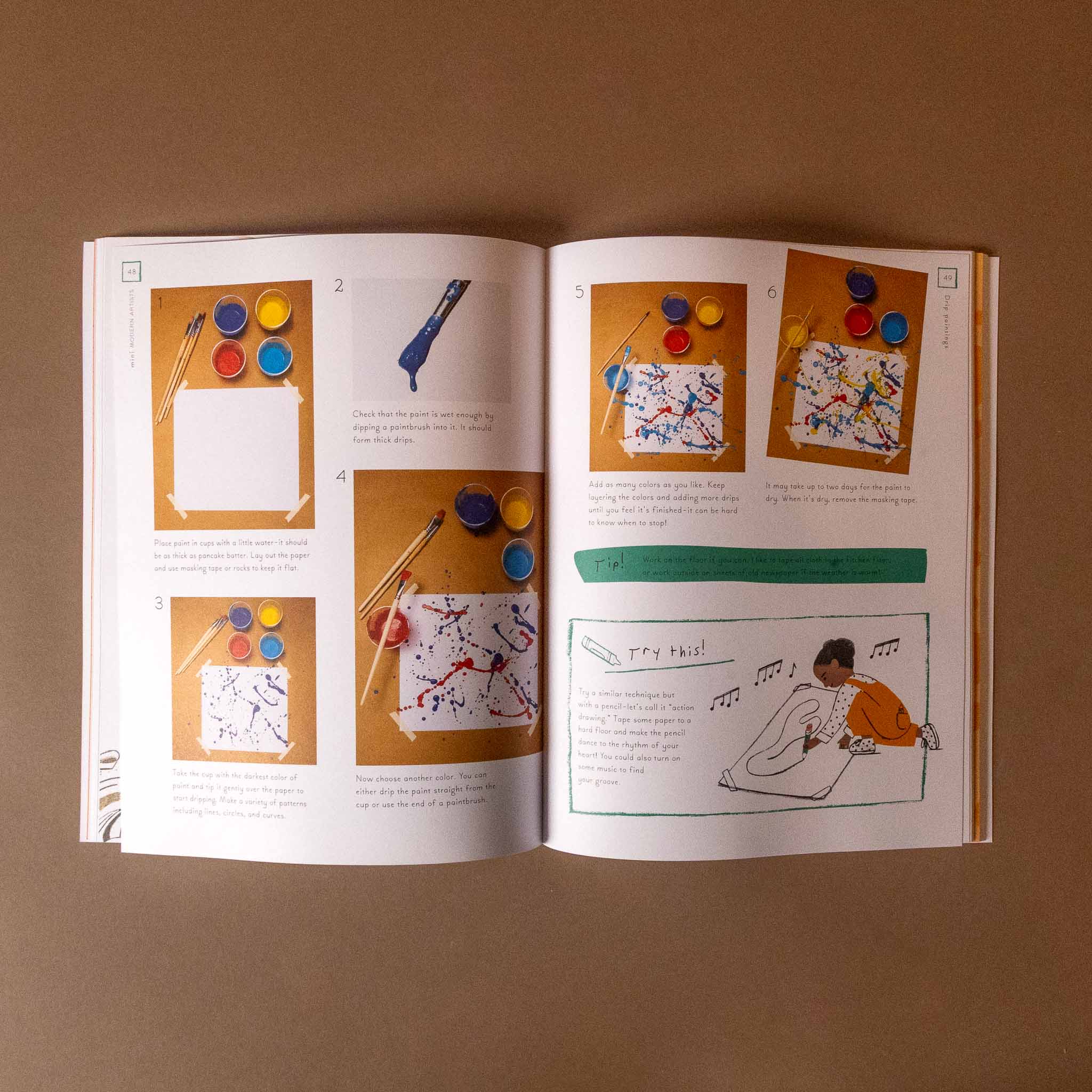 Open mini-artists-activity-book with illustrations and text on a brown background