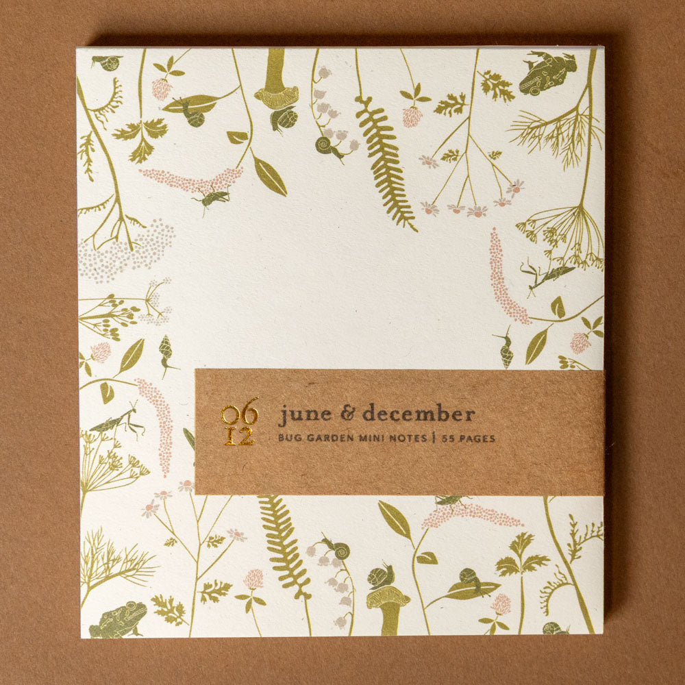 mini-notes-bug-garden with floral design on a brown background